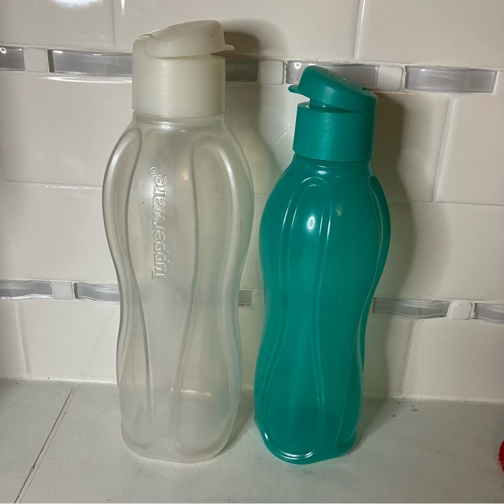 Tupperware Frosted clear and Teal Bottles with lids.